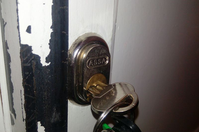 Key inserted in a cylinder deadbolt on a door